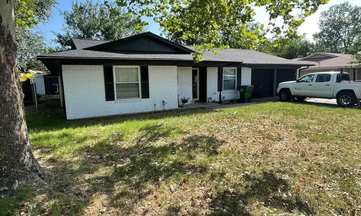 Professional roofing crew working on a residential roof in Moores Mill